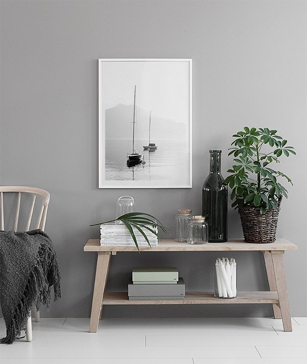 Stylish prints with a wooden frame. Boats on still water. Boats on still water.