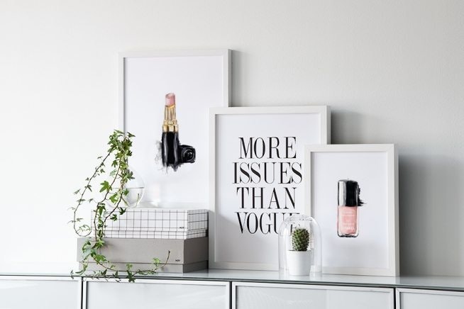 Posters and print with nail polish and lipstick from Chanel and Vogue.