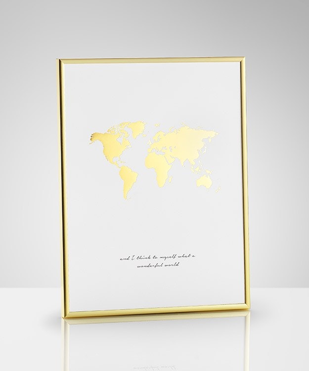 Gold and brass decor. Poster in gold frame 30x40cm