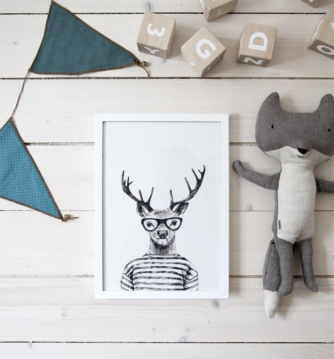 Poster with fun illustration in wooden frame with a reindeer wearing glasses